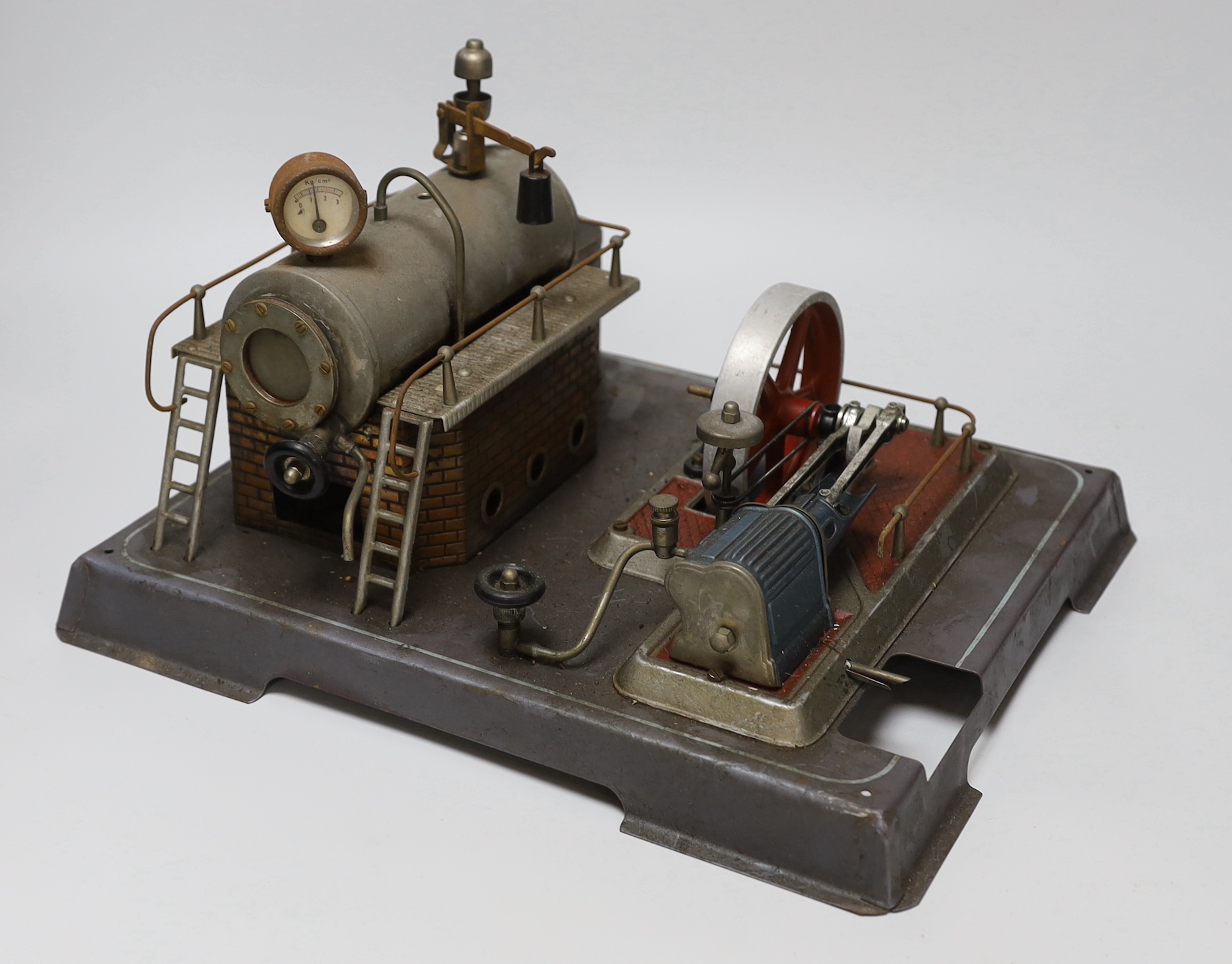 A Gamages single-cylinder steam engine, flywheel diameter 10cm